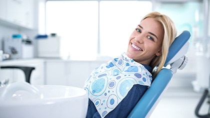 Smiling woman sitting in dental office